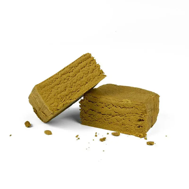 Yellow Lebanese THCA HASH – golden pressed resin slab Mousseux Oil on white background, ROLLZ own production.